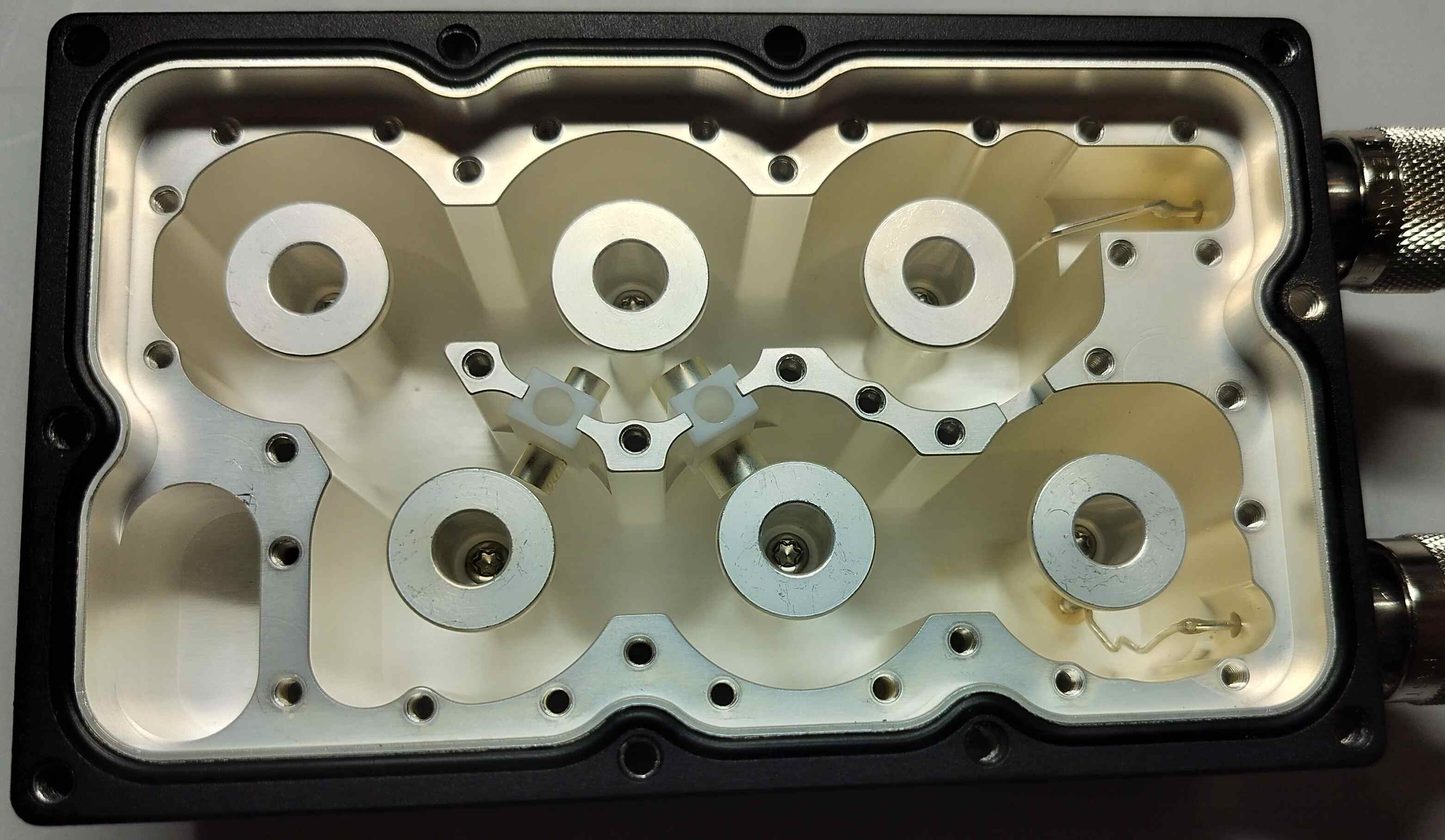 Underneath the second cover of the cavity filter